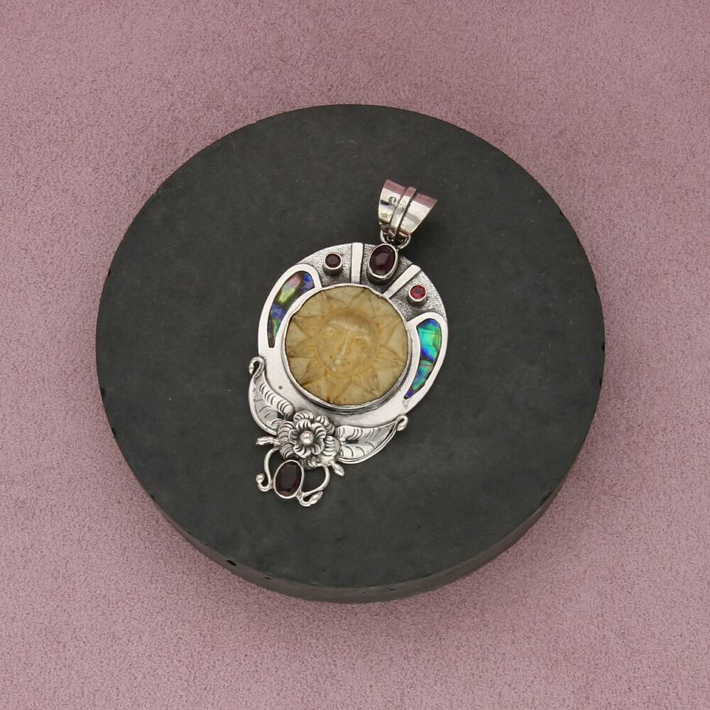 sterling silver abalone garnet carved sun pendant